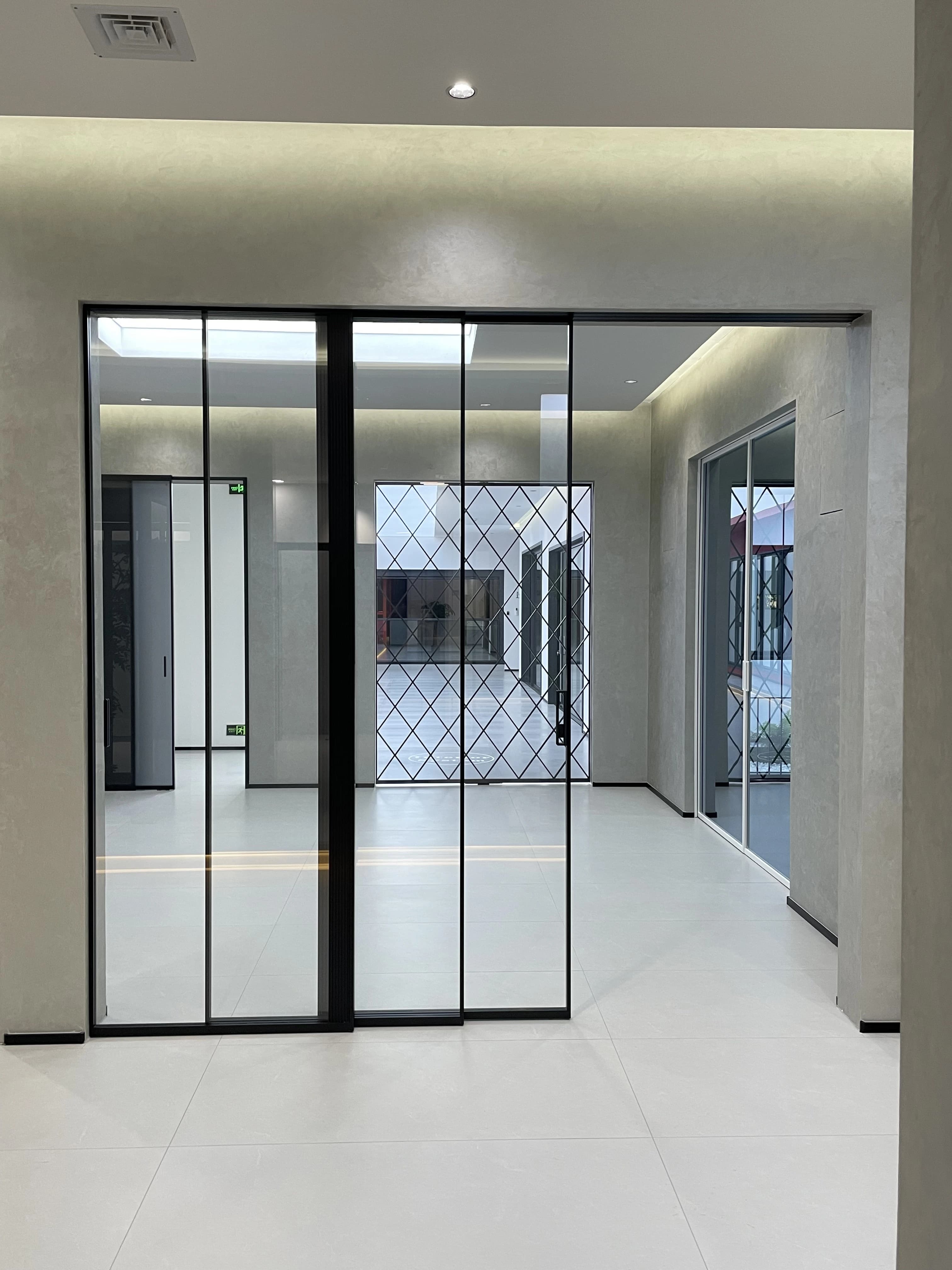 Custom built aluminium bi-fold doors seamlessly connecting indoor and outdoor living spaces